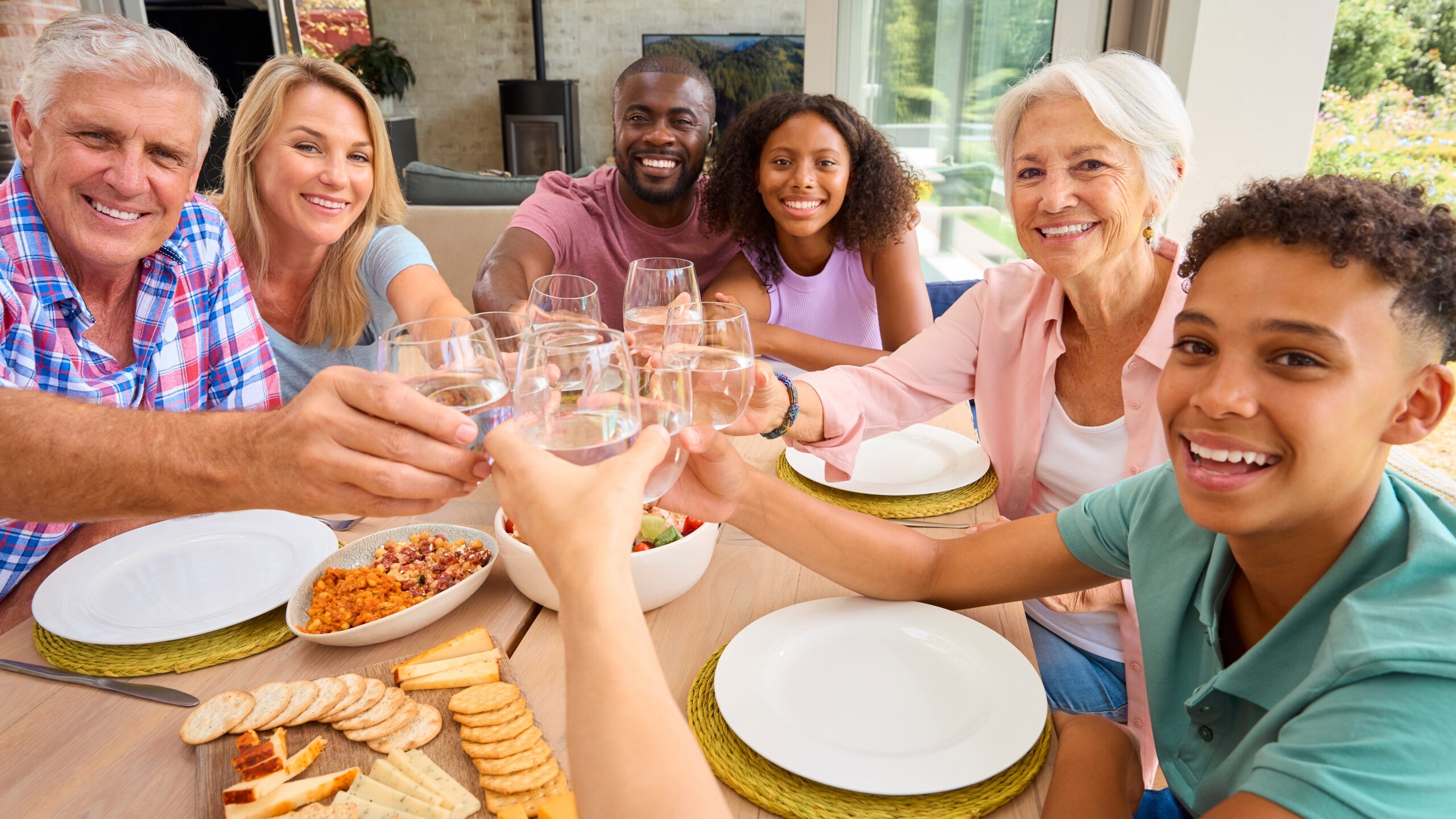 Family cheering glasses of water together