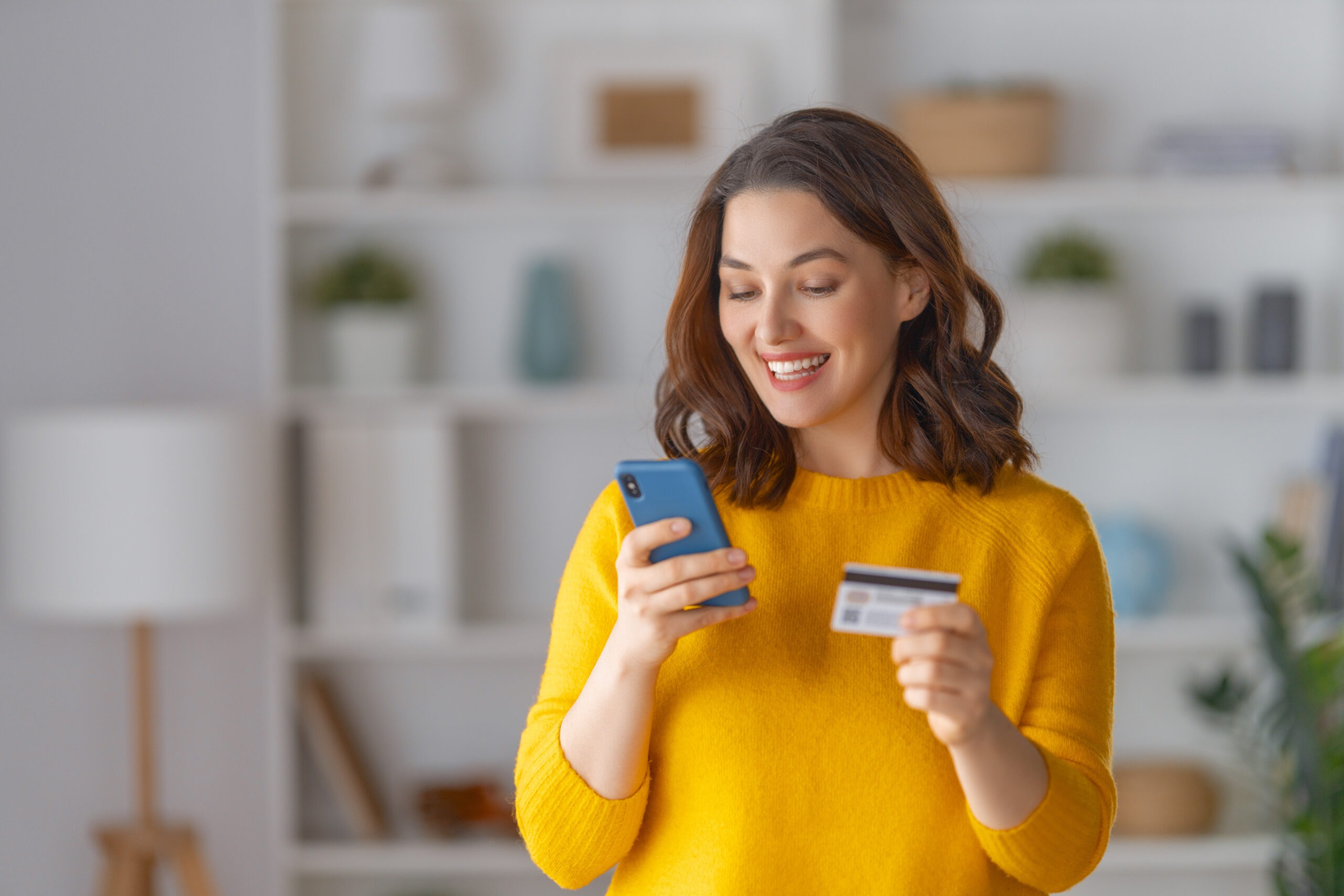 Woman signing up for bill payments on her phone